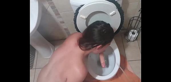  Human toilet bitch gets her face pissed on and lickssucks the toilet dildo clean and suck the dick